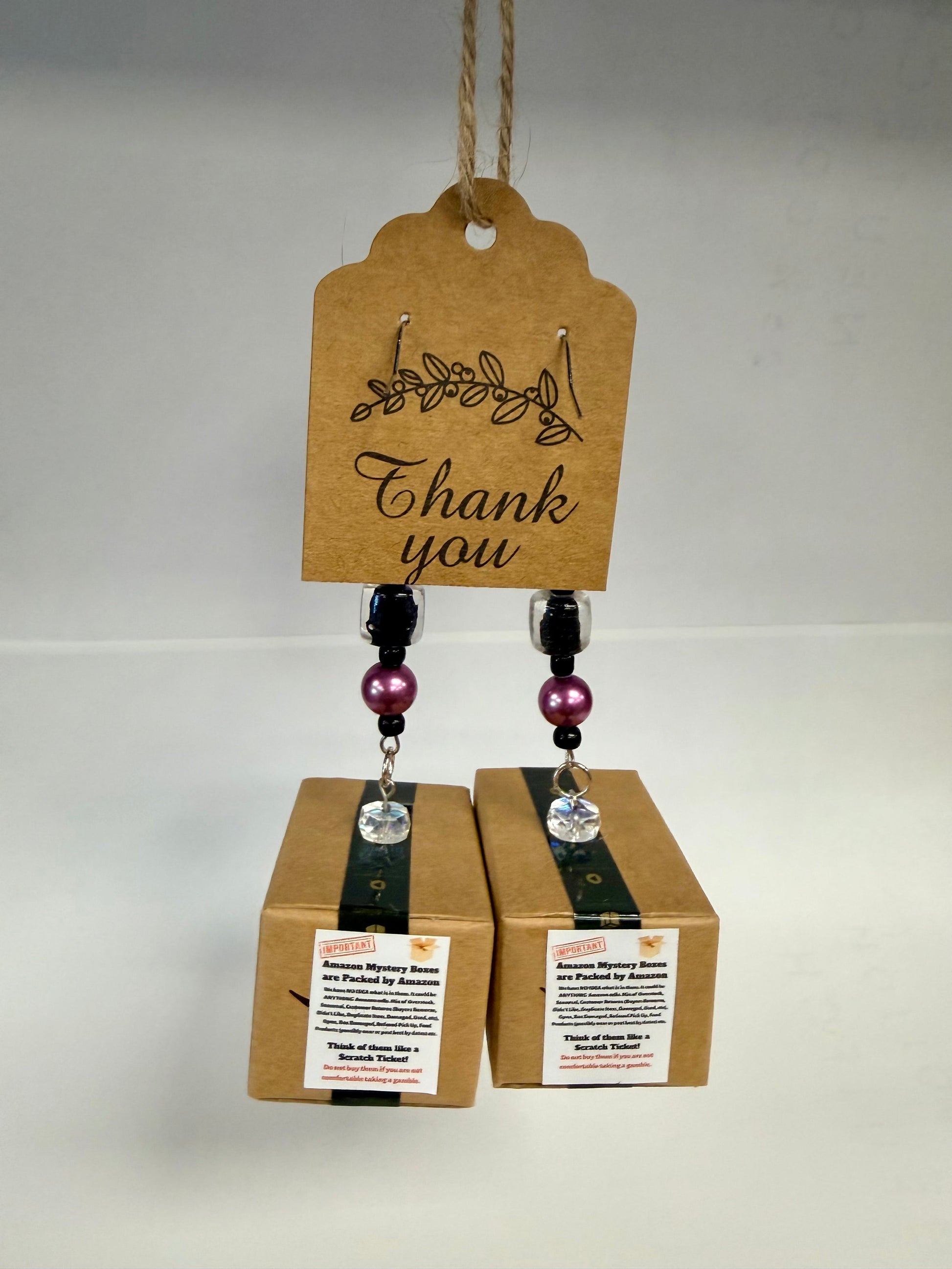 Miniature Amazon box earrings with tape details